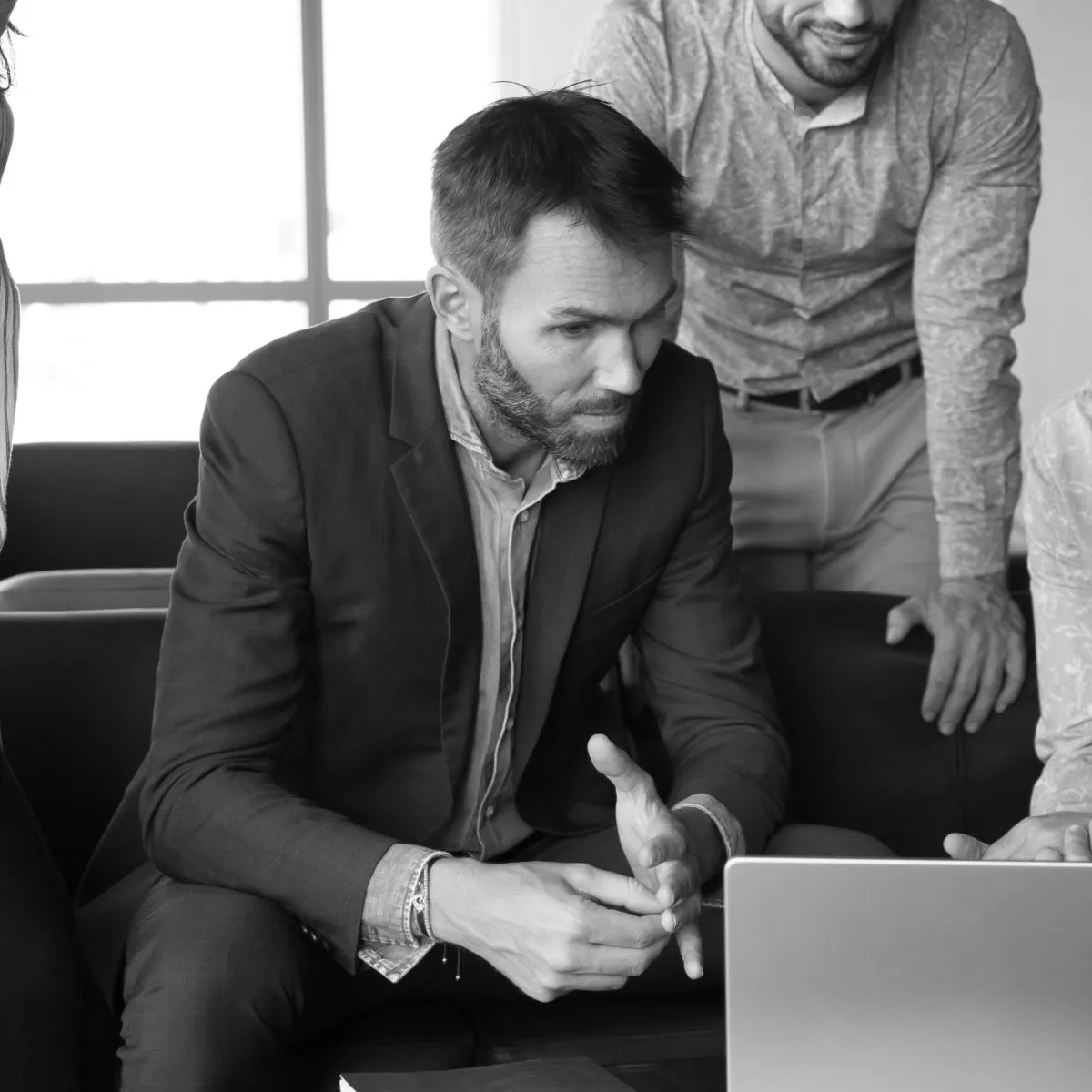 Colleagues reviewing AI output together on a laptop